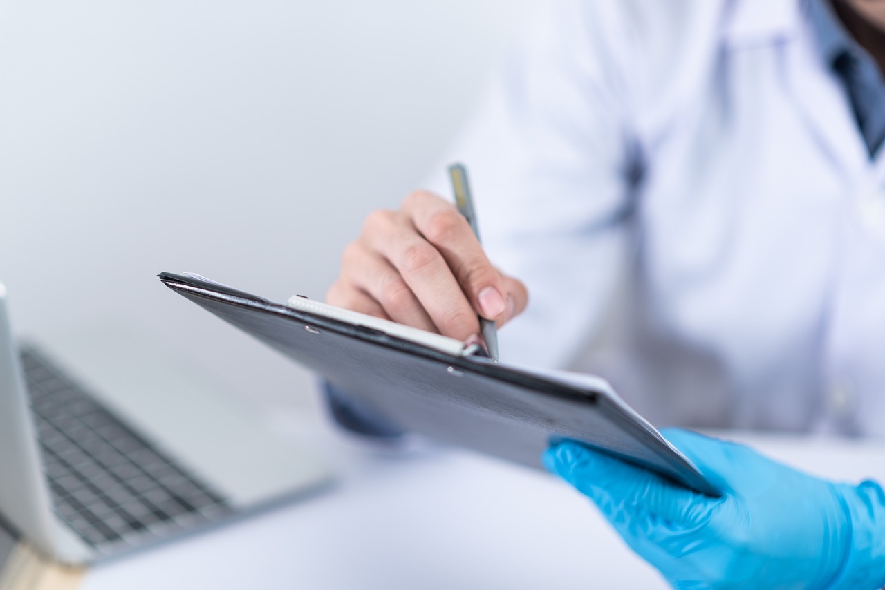 A doctor reviews a connected device.