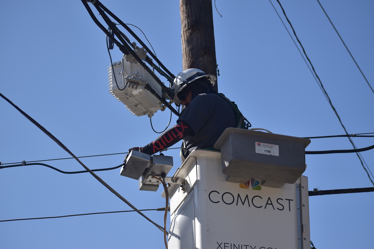 A comcast worker in a line truck.
