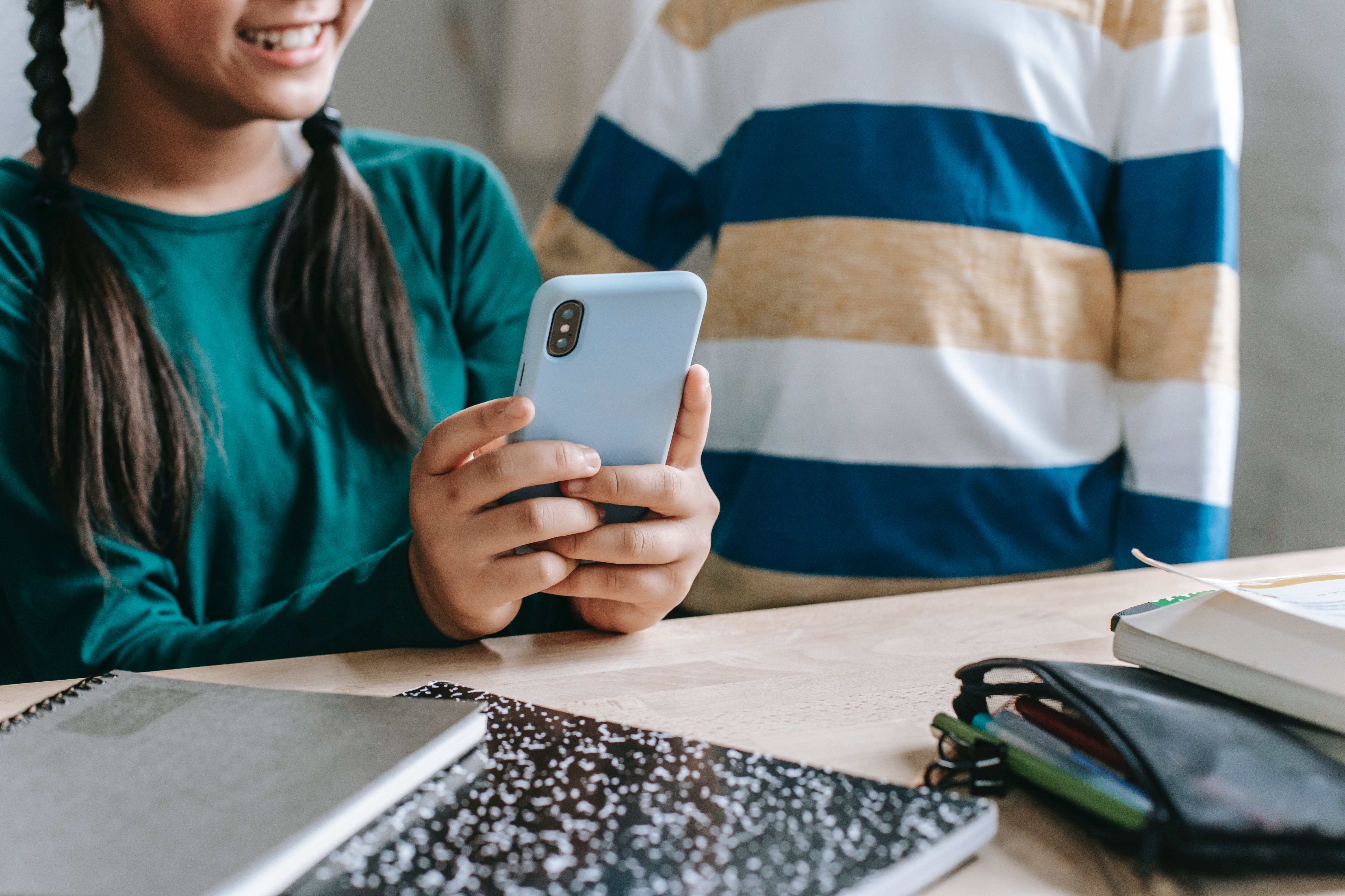 Photo representing digital devices being used in an educational setting.