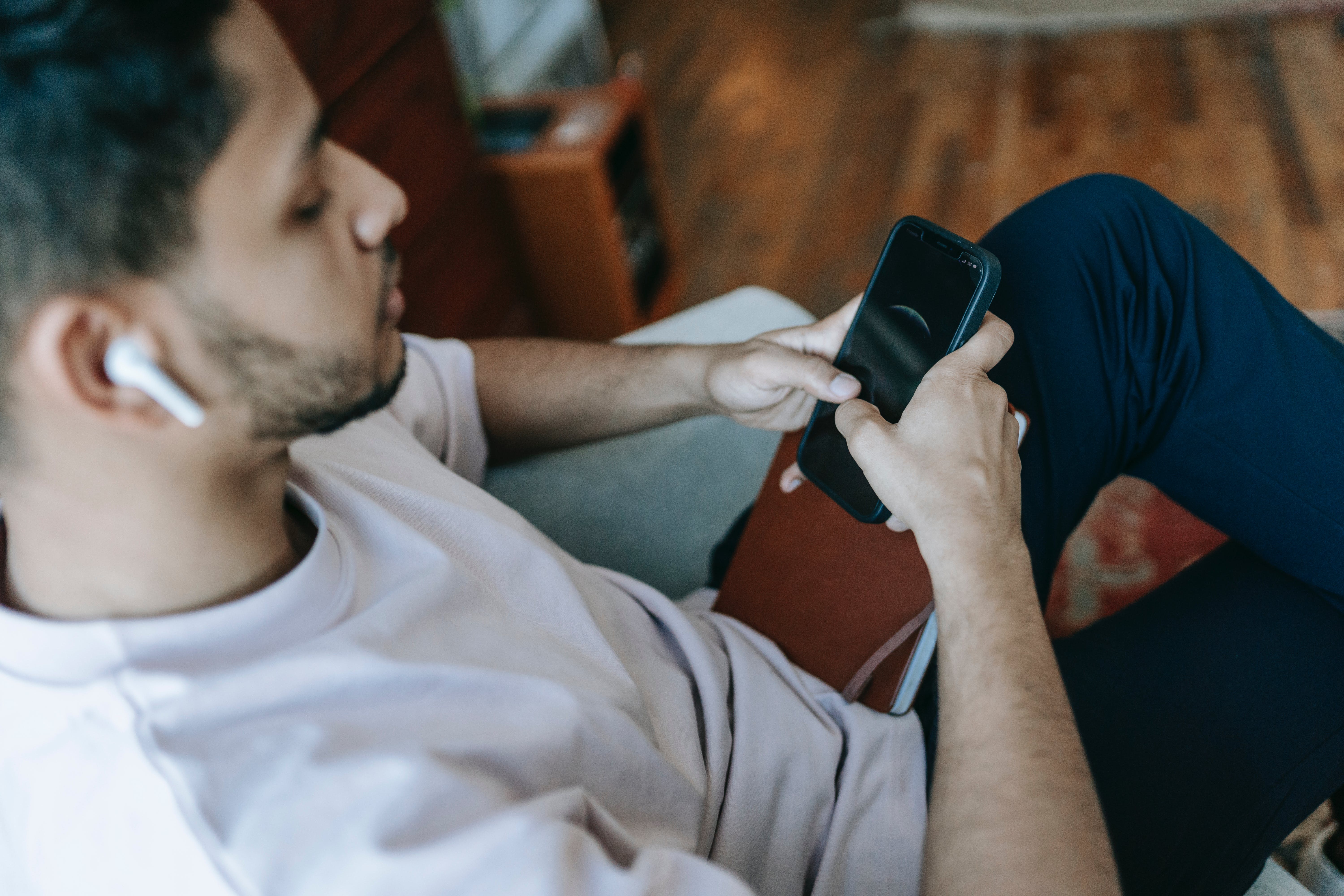 A young person using connected devices.