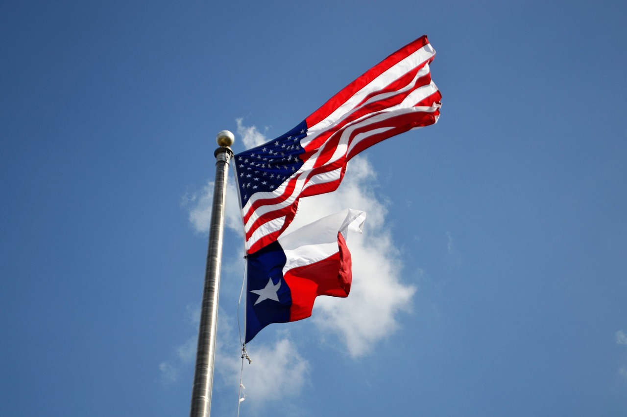 The flag of the U.S. and the state of Texas.