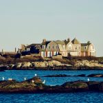a group of houses on a rocky island