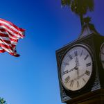 brown wooden analog clock at 10 10