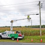 Comcast truck in a corn field photo