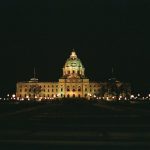 a large building lit up at night time