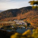 a scenic view of a lake surrounded by trees