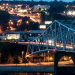 a bridge over a body of water at night