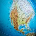 Detailed close-up of a globe highlighting North America, focusing on the USA and surrounding countries.