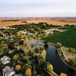 aerial view of green grass field and trees during daytime