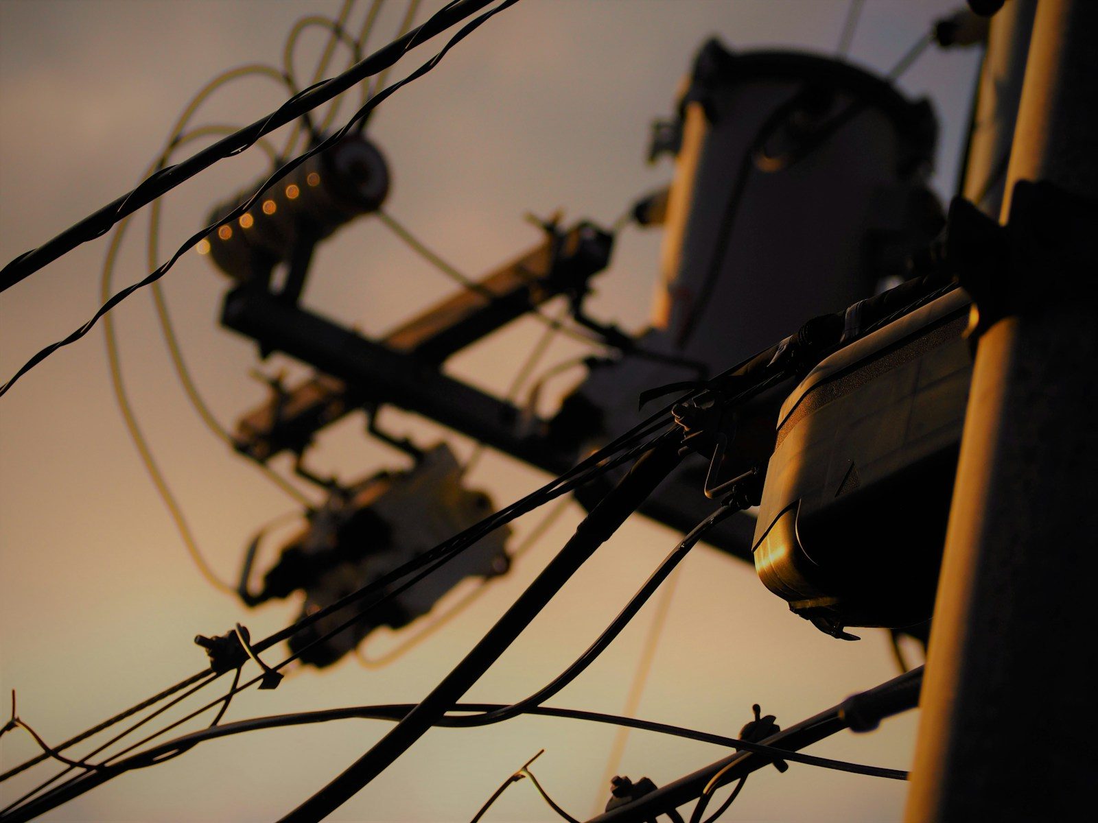 macro photography of black electrical wirings