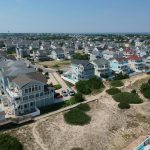 an aerial view of a beach town with a lot of houses
