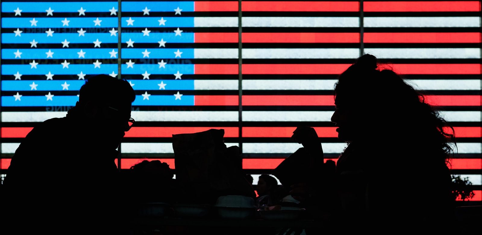 silhouette of people sitting on chair