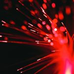 A close up of a red and black firework