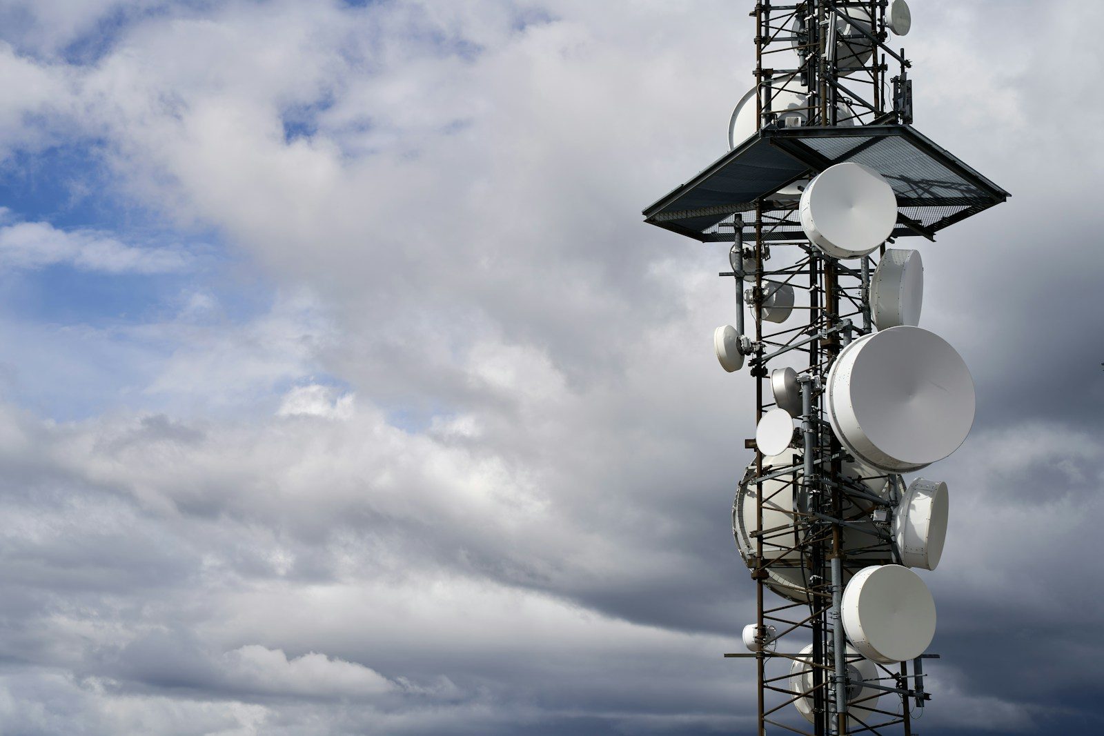 a satellite dish on a pole