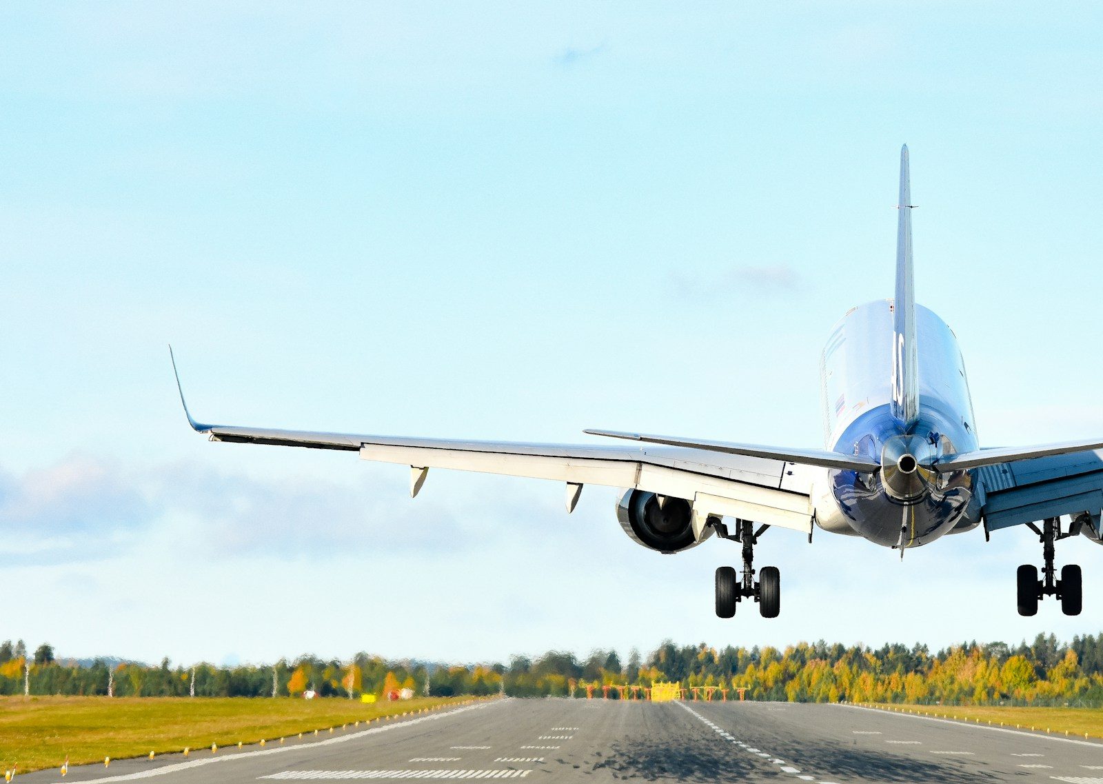 An airplane taking off from an airport runway
