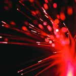 A close up of a red and black firework